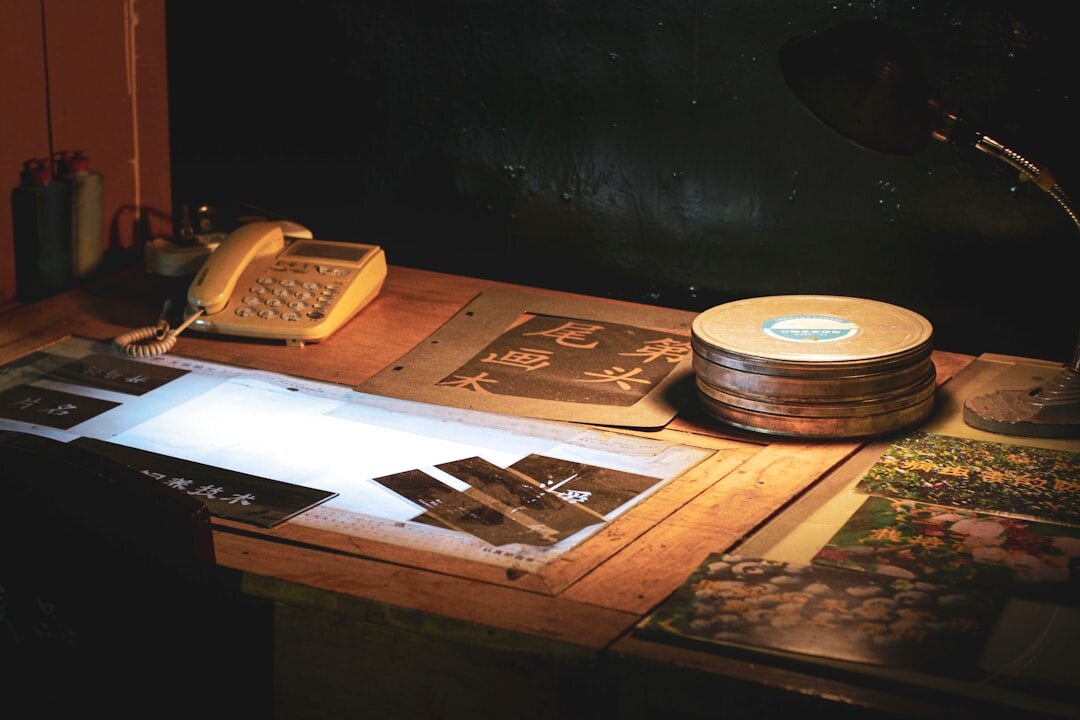 Detective desk with case files, a magnifying glass and old photographs